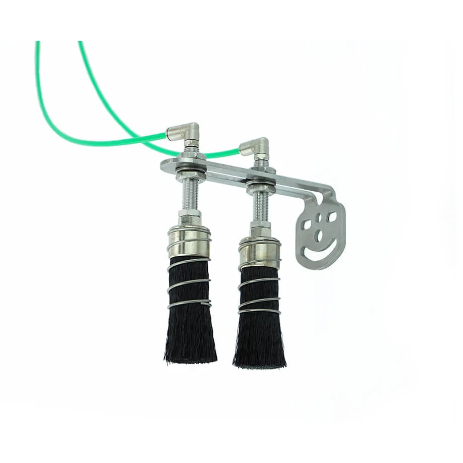 Two lubricating brushes on mounting bracket